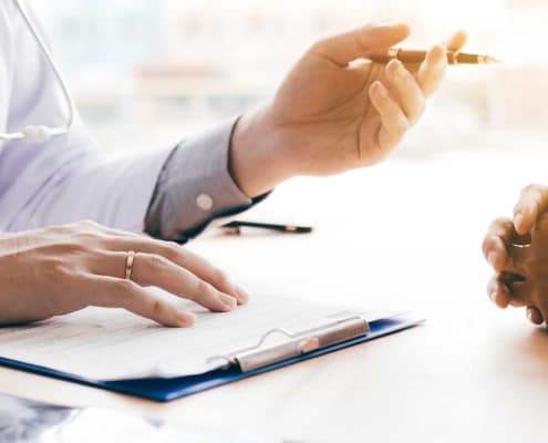 Close up view of a doctor discussing health with patient