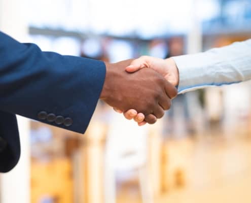 close up view of business professionals shaking hands