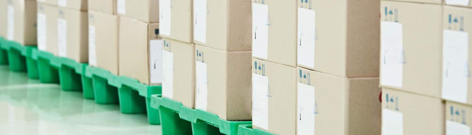 close up view stacked boxes in a warehouse