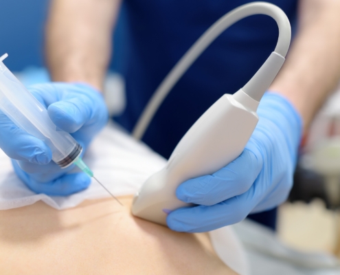 Mammalogist doctor examines woman breasts and lymph nodes during appointment