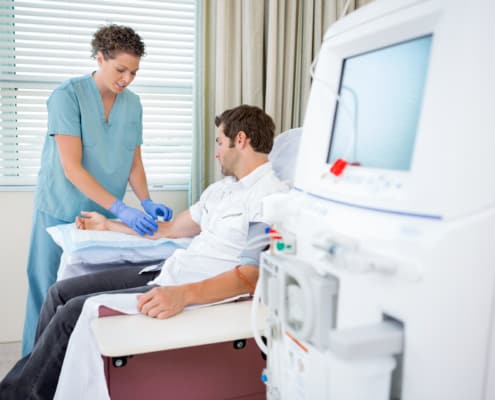 Nurse working with a patient