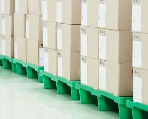 close up view stacked boxes in a warehouse